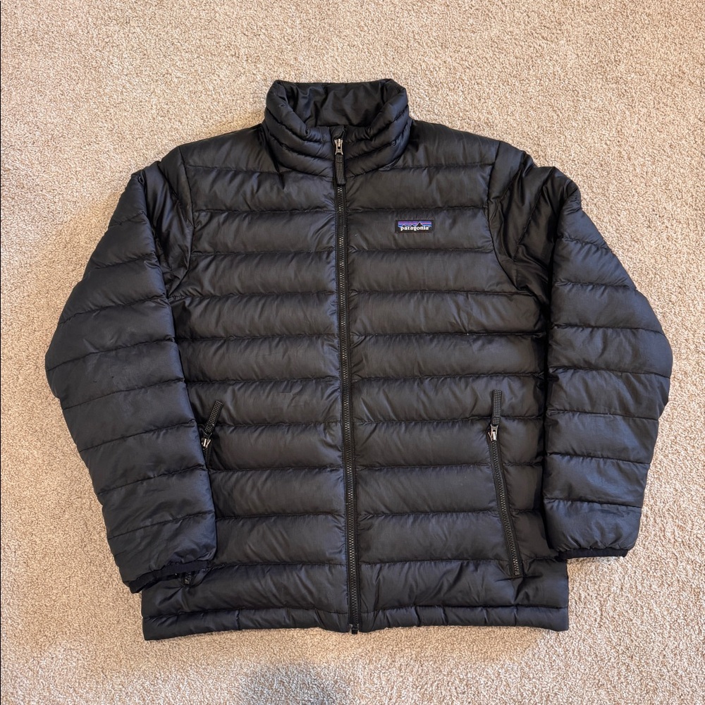 Patagonia size 12 (L) black down sweater. Play condition due to elbow wear